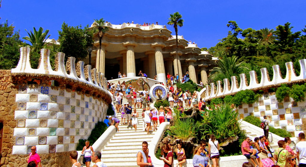 Large building with many people around a large staircase