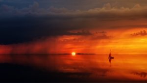 boat sailing on the sea during sunset