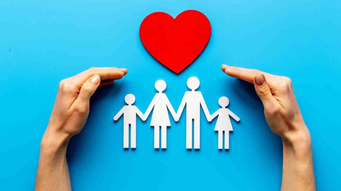 Picture of a family with a heart over, What is a Family Health Insurance Plan?